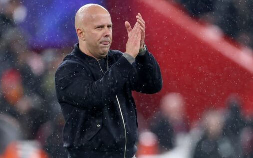 Liverpool manager Arne Slot looking thoughtful on the touchline during a Premier League match
