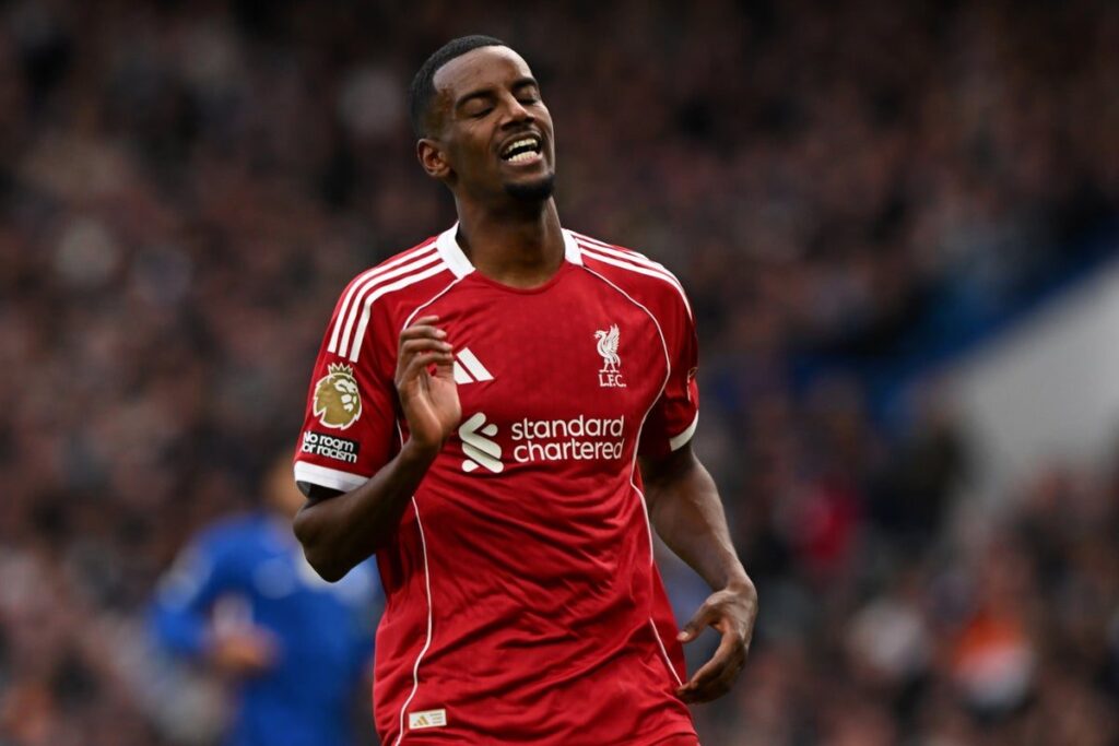 Alexander Isak in a Liverpool kit preparing to play in a football match