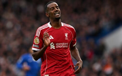 Alexander Isak in a Liverpool kit preparing to play in a football match