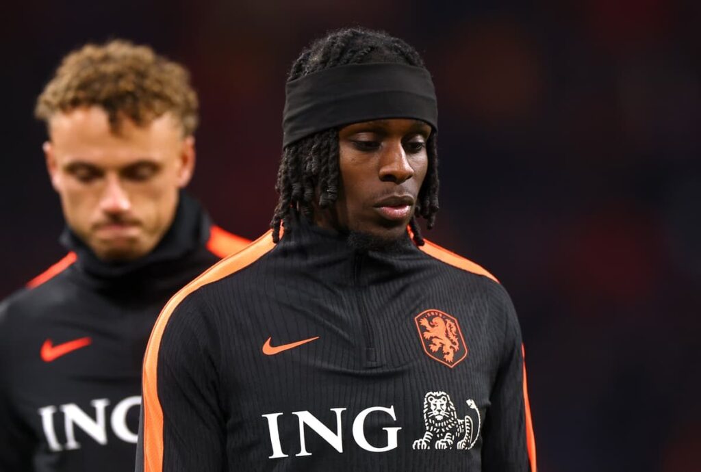 Jeremie Frimpong looking dejected in a Liverpool shirt on the pitch