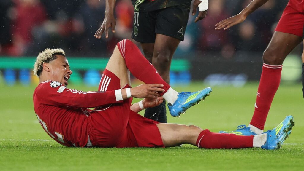 Liverpool striker Hugo Ekitike walking on the pitch during a Premier League match