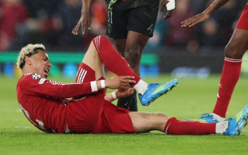 Liverpool striker Hugo Ekitike walking on the pitch during a Premier League match