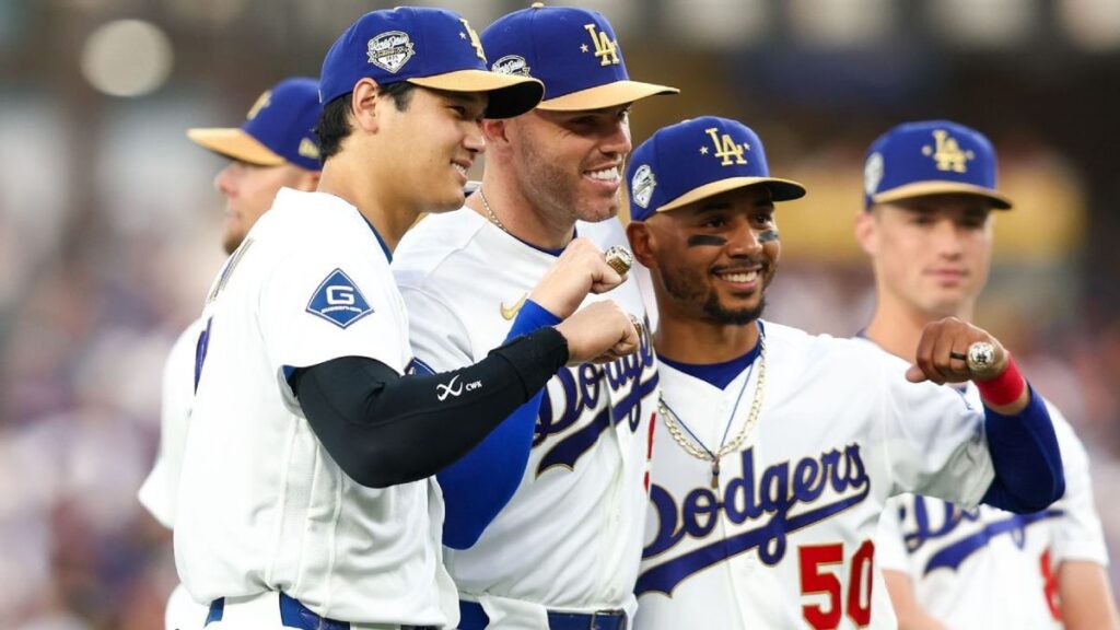 Los Angeles Dodgers players celebrating together on the field during a Major League Baseball game.