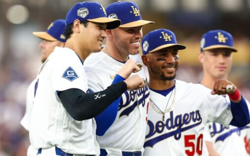 Los Angeles Dodgers players celebrating together on the field during a Major League Baseball game.