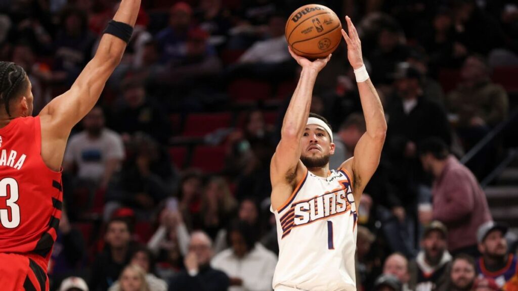 Luka Doncic of the Los Angeles Lakers watching from the sidelines