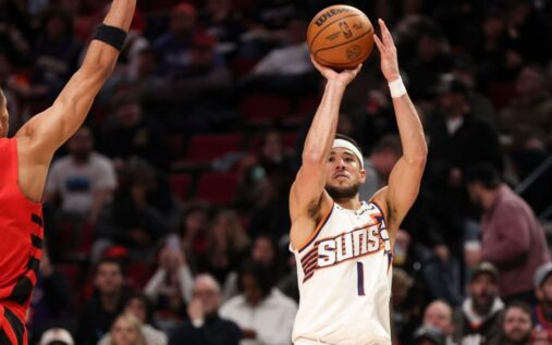 Luka Doncic of the Los Angeles Lakers watching from the sidelines