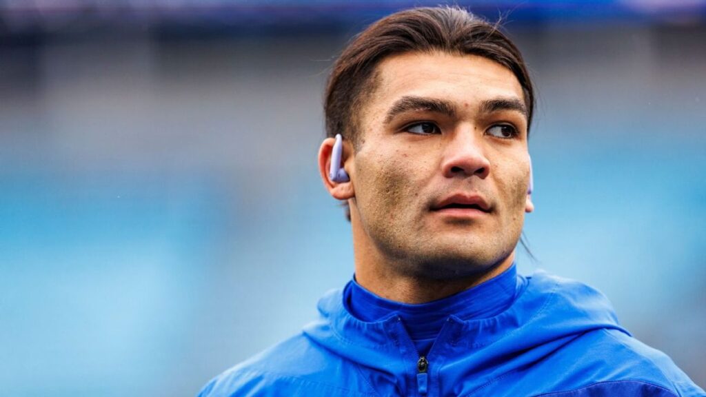 Los Angeles Rams wide receiver Puka Nacua standing on the field during an NFL match