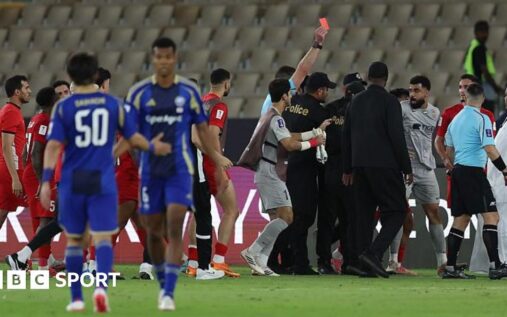 Referee Shaun Evans surrounded by furious Shabab Al-Ahli players during the Asian Champions League semi-final