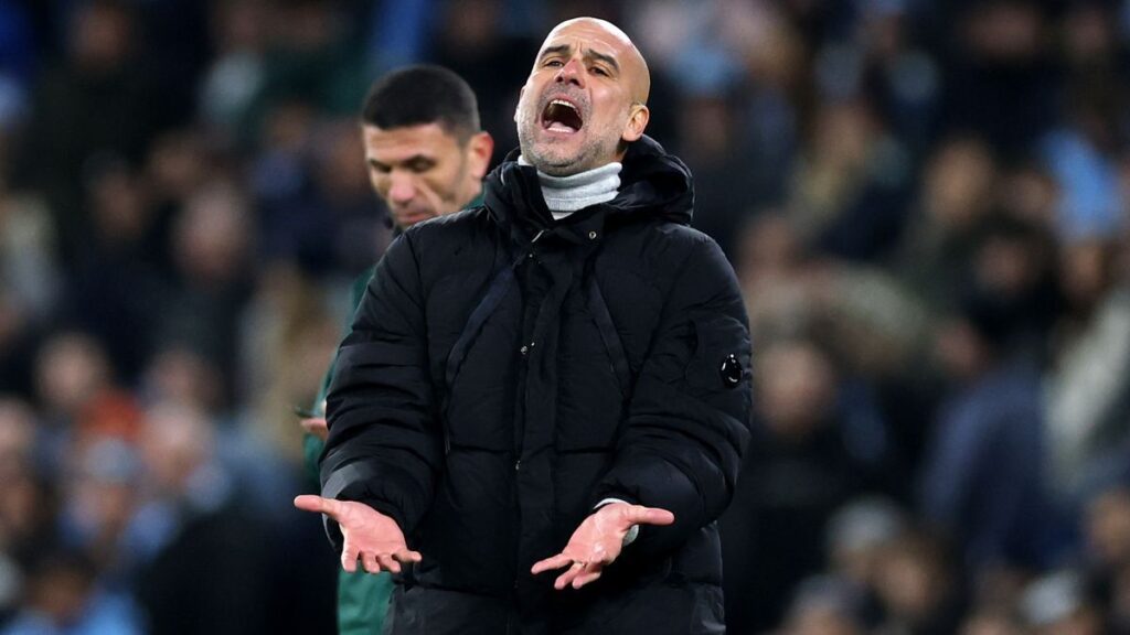 Manchester City manager Pep Guardiola looking concerned on the touchline during a Premier League match