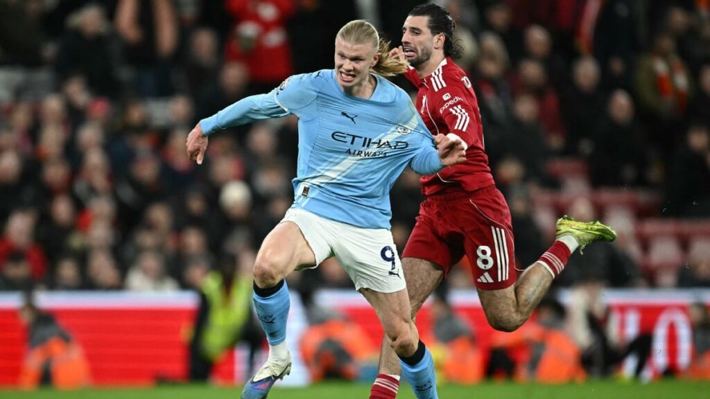 Manchester City and Liverpool players competing for the ball during an FA Cup match