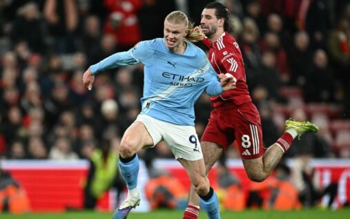 Manchester City and Liverpool players competing for the ball during an FA Cup match