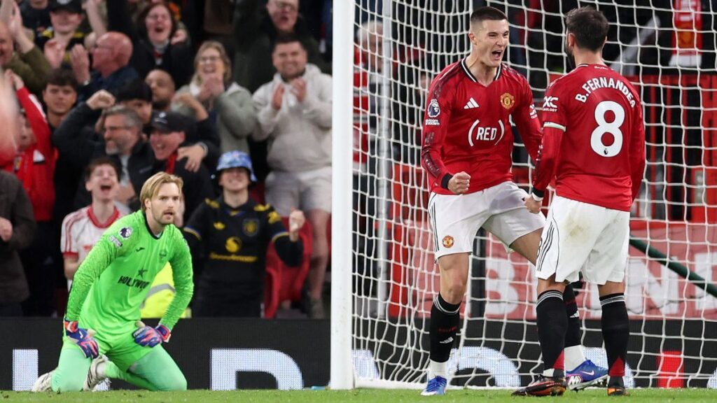 Manchester United players celebrate scoring a goal against Brentford in the Premier League at Old Trafford