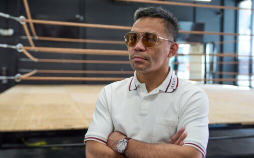 Manny Pacquiao and Floyd Mayweather facing off in the boxing ring