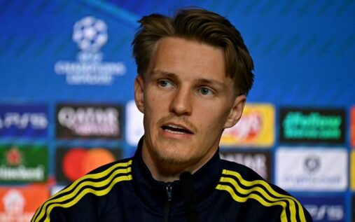 Arsenal captain Martin Odegaard applauding the fans on the pitch
