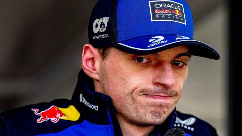 Max Verstappen looking frustrated in his Red Bull team gear at the Japanese Grand Prix
