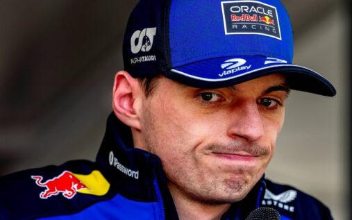 Max Verstappen looking frustrated in his Red Bull team gear at the Japanese Grand Prix
