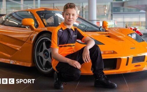 11-year-old karting driver Harry Williams wearing a racing helmet in his kart