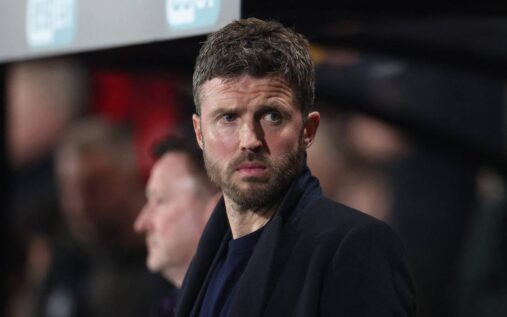 Michael Carrick standing on the touchline managing Manchester United