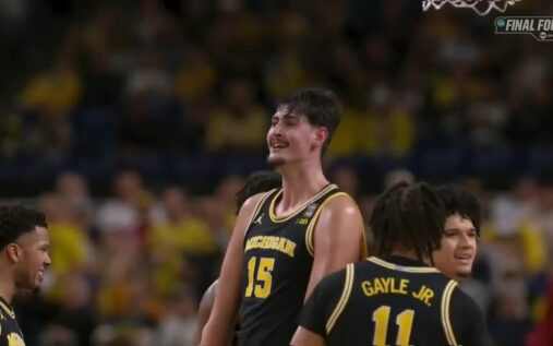 Aday Mara shooting the basketball for Michigan Wolverines against Arizona Wildcats