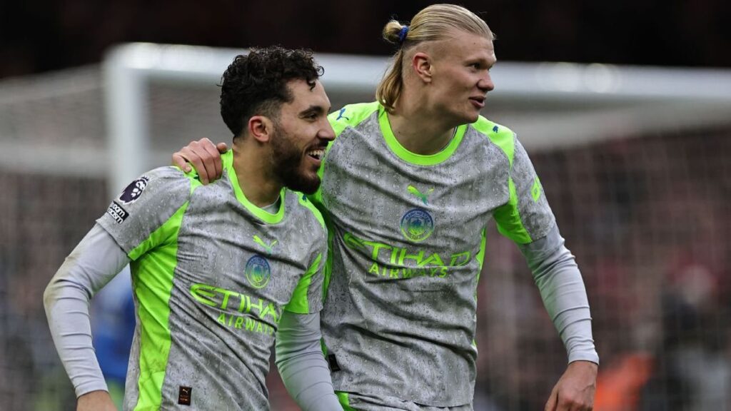 Mohamed Salah looking thoughtful on the pitch during a Liverpool Premier League match
