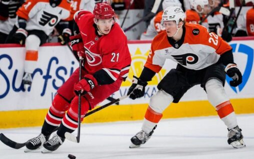 Ice hockey players battling for the puck during an NHL regular season match