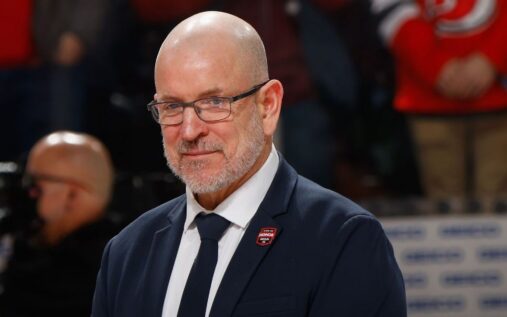 Tom Fitzgerald looking on from the stands during a New Jersey Devils NHL game