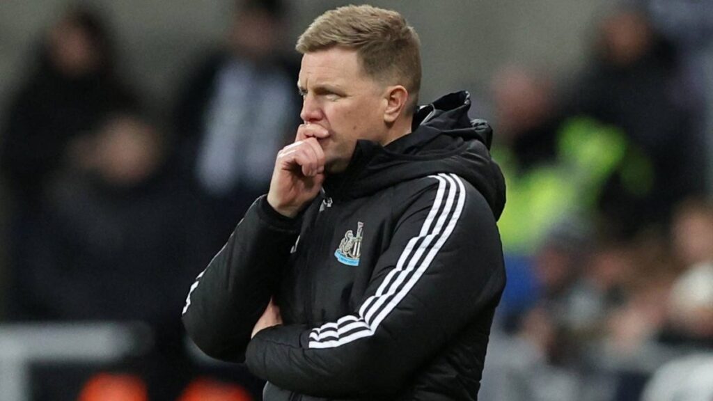 Newcastle United manager Eddie Howe standing on the touchline looking focused