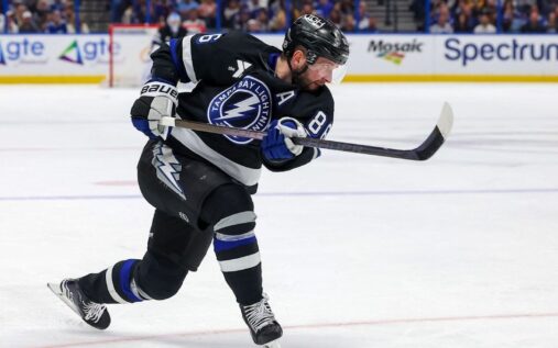 Nikita Kucherov skating on the ice in a Tampa Bay Lightning jersey.