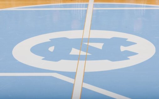 Arizona head coach Tommy Lloyd looking focused during a men's college basketball game