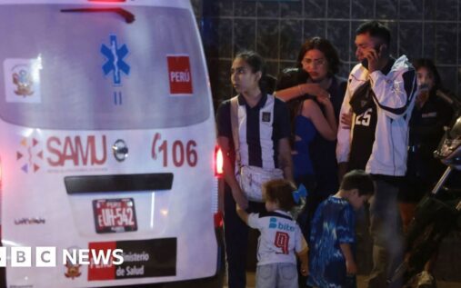 Fans gathered outside Alejandro Villanueva Stadium wearing Alianza Lima football shirts and waving flags