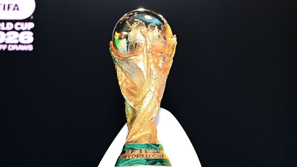 Thomas Tuchel and Steve Clarke standing on the touchline during an international football match