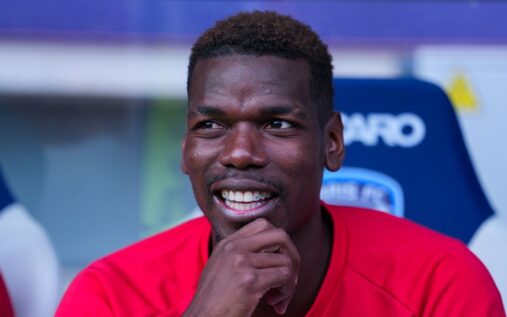 Paul Pogba wearing a Monaco jersey looking determined during a press conference