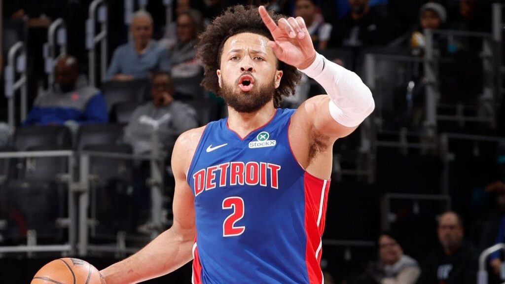 Detroit Pistons guard Cade Cunningham dribbling a basketball on the court