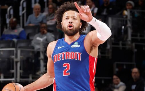 Detroit Pistons guard Cade Cunningham dribbling a basketball on the court