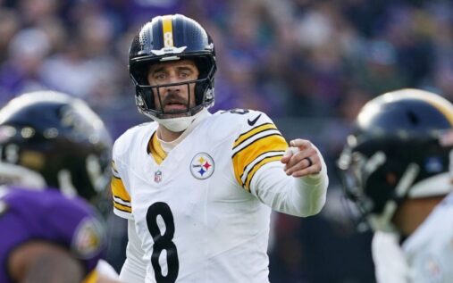 Aaron Rodgers looking across the field during a Pittsburgh Steelers NFL match