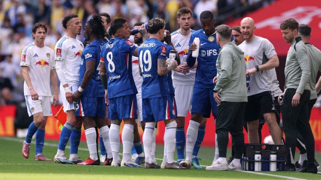 Chelsea goalkeeper Robert Sanchez receiving medical treatment on the pitch during a match