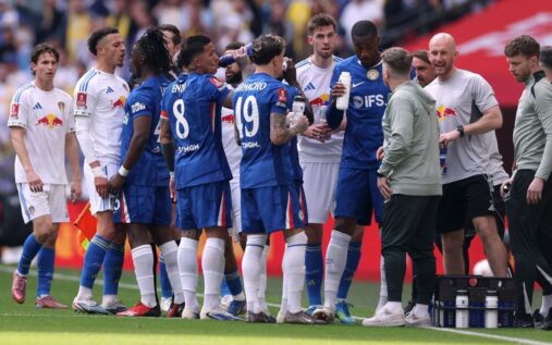 Chelsea goalkeeper Robert Sanchez receiving medical treatment on the pitch during a match