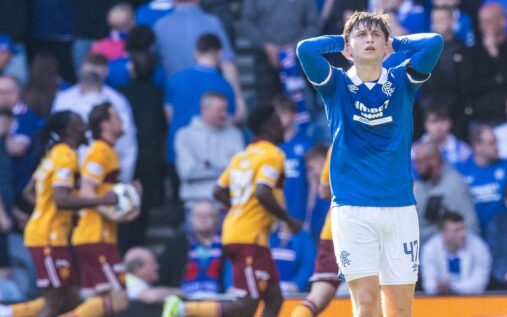 Motherwell players celebrating their late winning goal against Rangers at Ibrox Stadium
