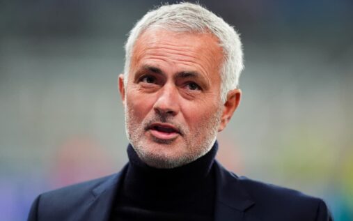 Jose Mourinho standing on the touchline directing his players during a football match