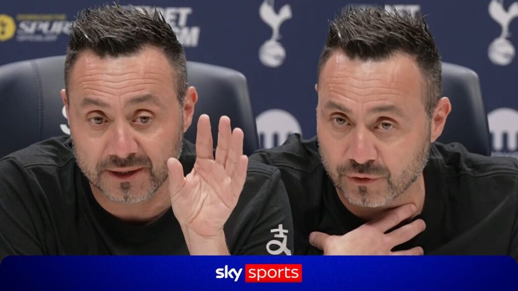 Roberto De Zerbi speaking into a microphone during his first press conference as Tottenham Hotspur head coach