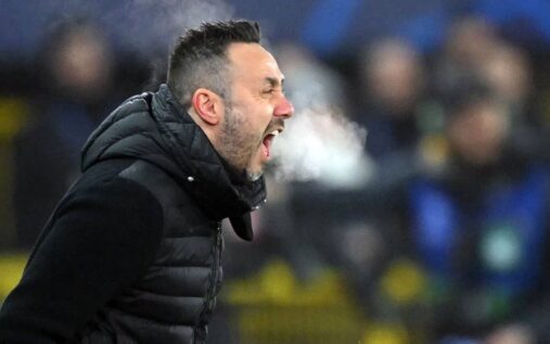 Roberto De Zerbi looking focused on the touchline while managing Tottenham Hotspur
