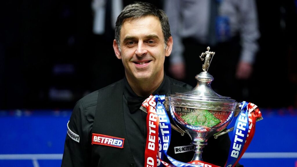 Ronnie O'Sullivan preparing to strike the cue ball during a snooker match