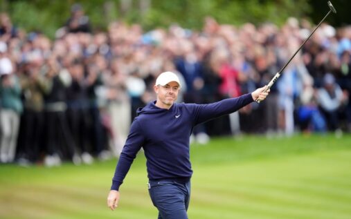 Defending US Masters champion Rory McIlroy lining up a putt on the green at Augusta National