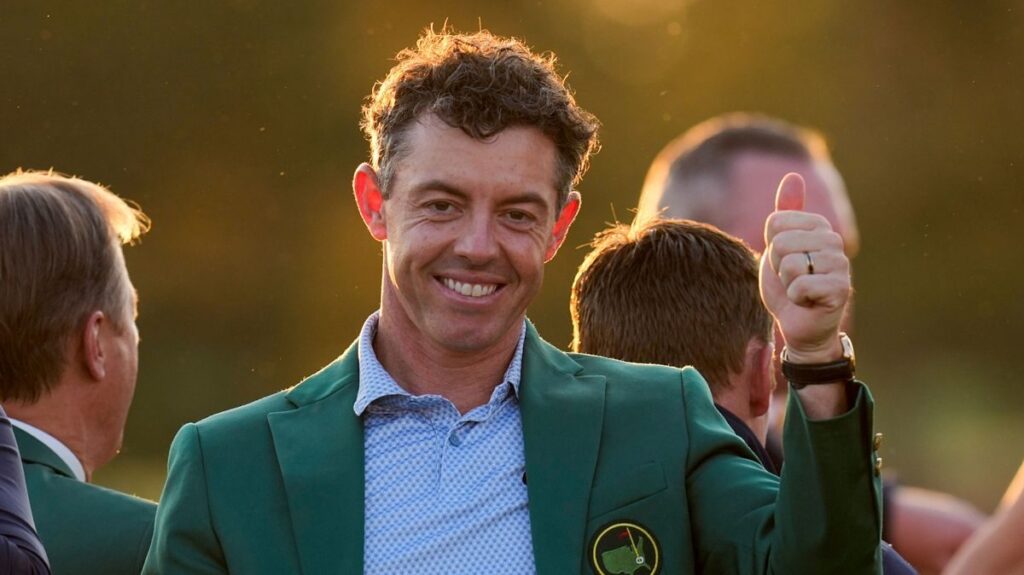 Rory McIlroy celebrating in the famous Green Jacket after winning the Masters at Augusta National