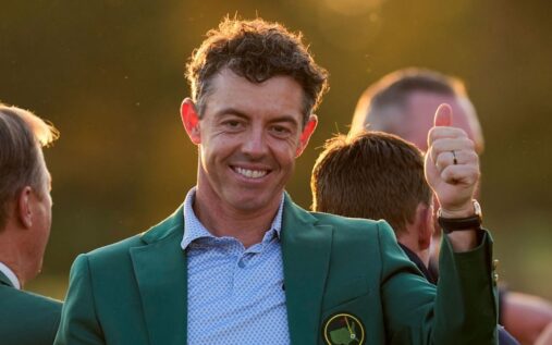 Rory McIlroy celebrating in the famous Green Jacket after winning the Masters at Augusta National
