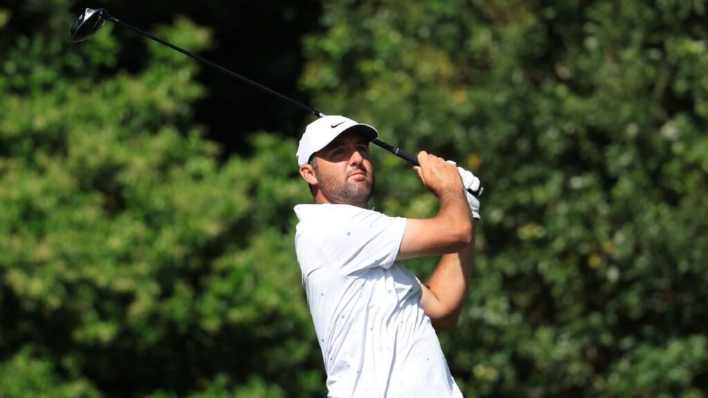 Rory McIlroy wearing the iconic green jacket and smiling after winning the Masters at Augusta National