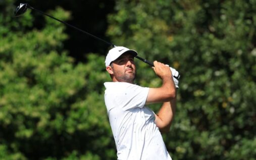 Rory McIlroy wearing the iconic green jacket and smiling after winning the Masters at Augusta National