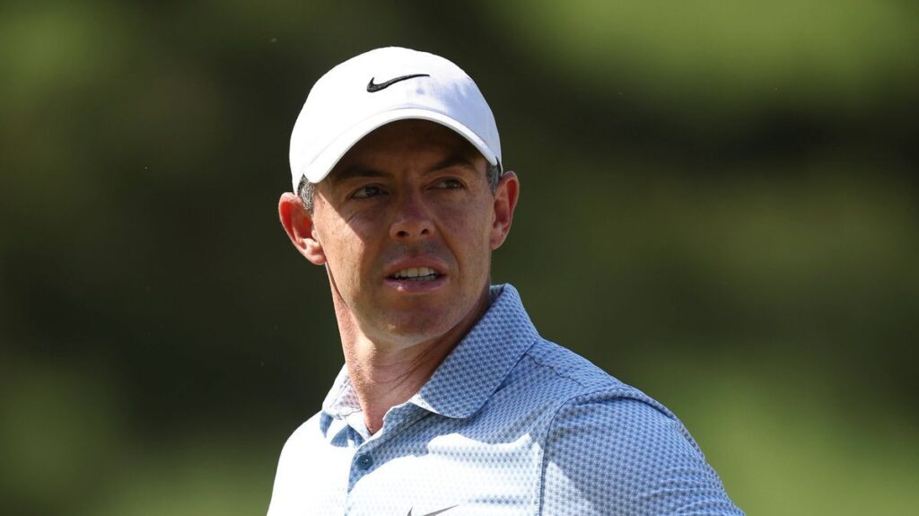 Rory McIlroy wearing the green jacket and smiling after winning the 2025 Masters at Augusta National