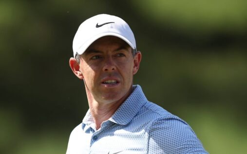 Rory McIlroy wearing the green jacket and smiling after winning the 2025 Masters at Augusta National