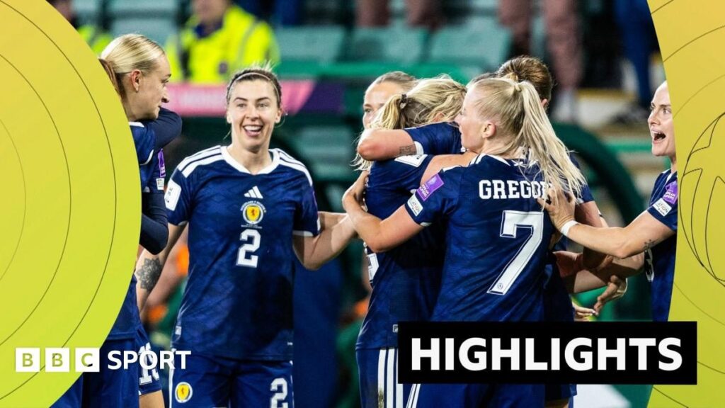 Scottish football players celebrating a late stoppage-time goal against Belgium